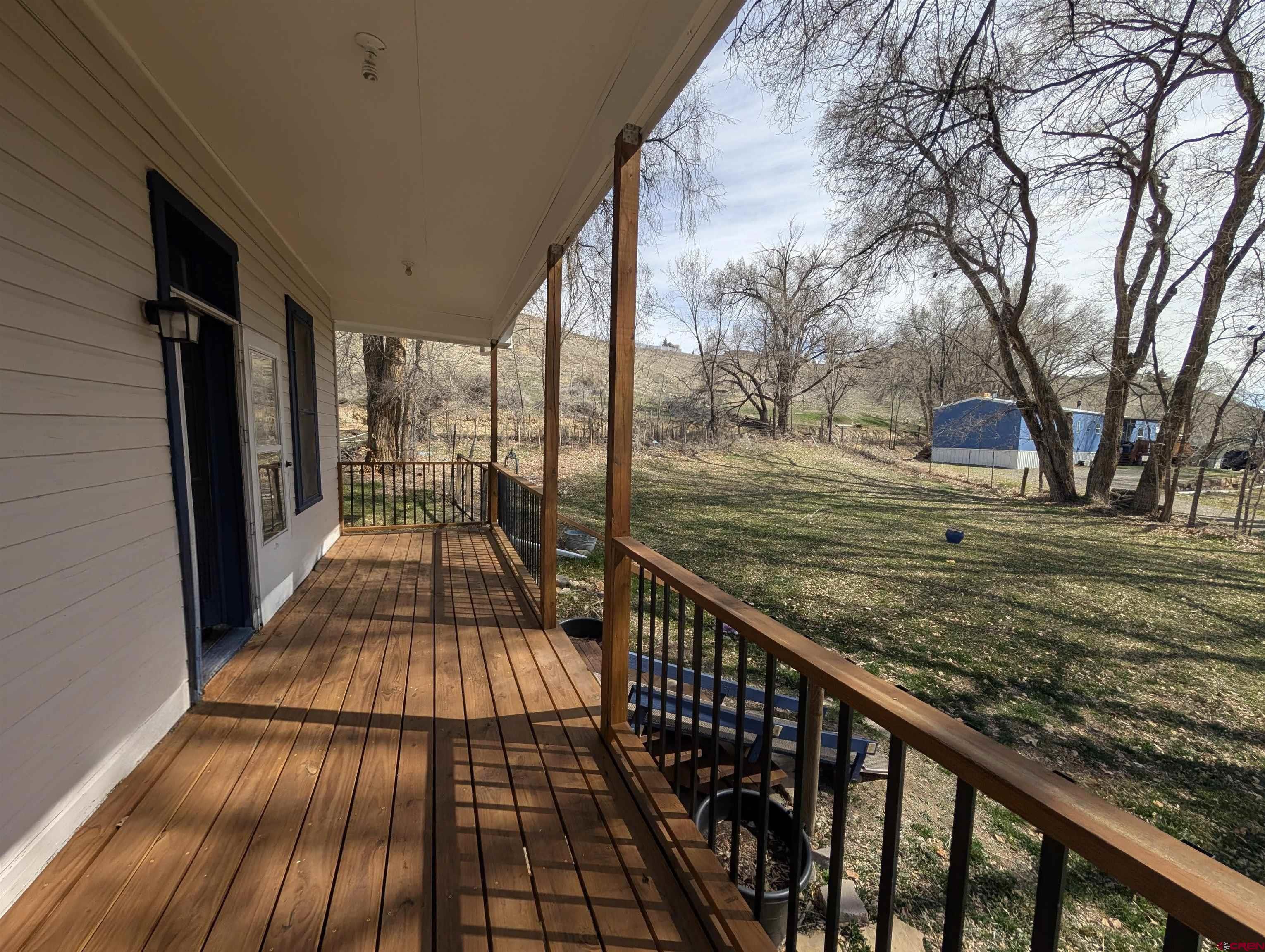 16184 Chipeta Road Montrose, CO 81403 - Photo 18 of 24 a view of balcony with wooden floor