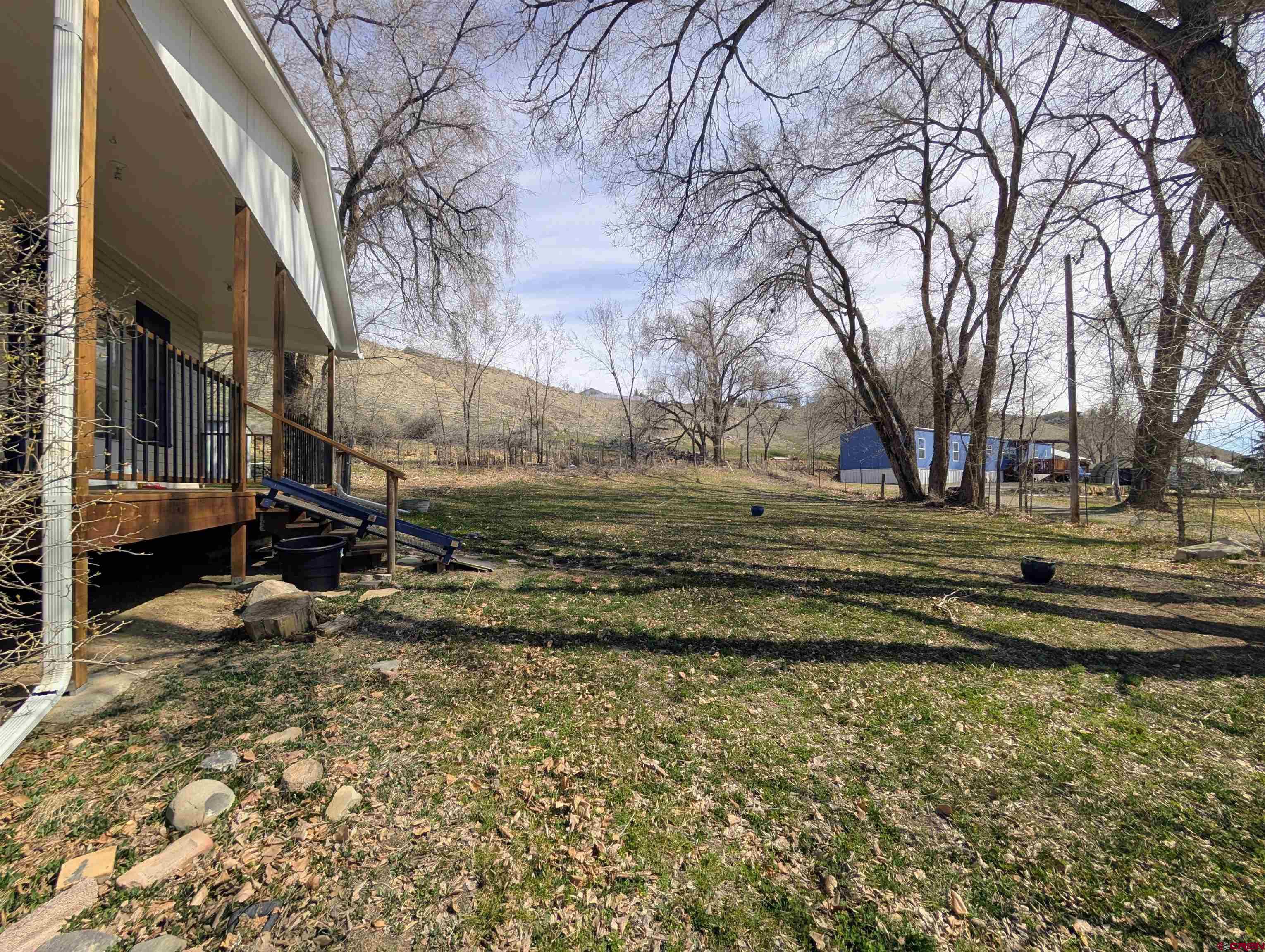 16184 Chipeta Road Montrose, CO 81403 - Photo 20 of 24 a view of a yard with wooden fence