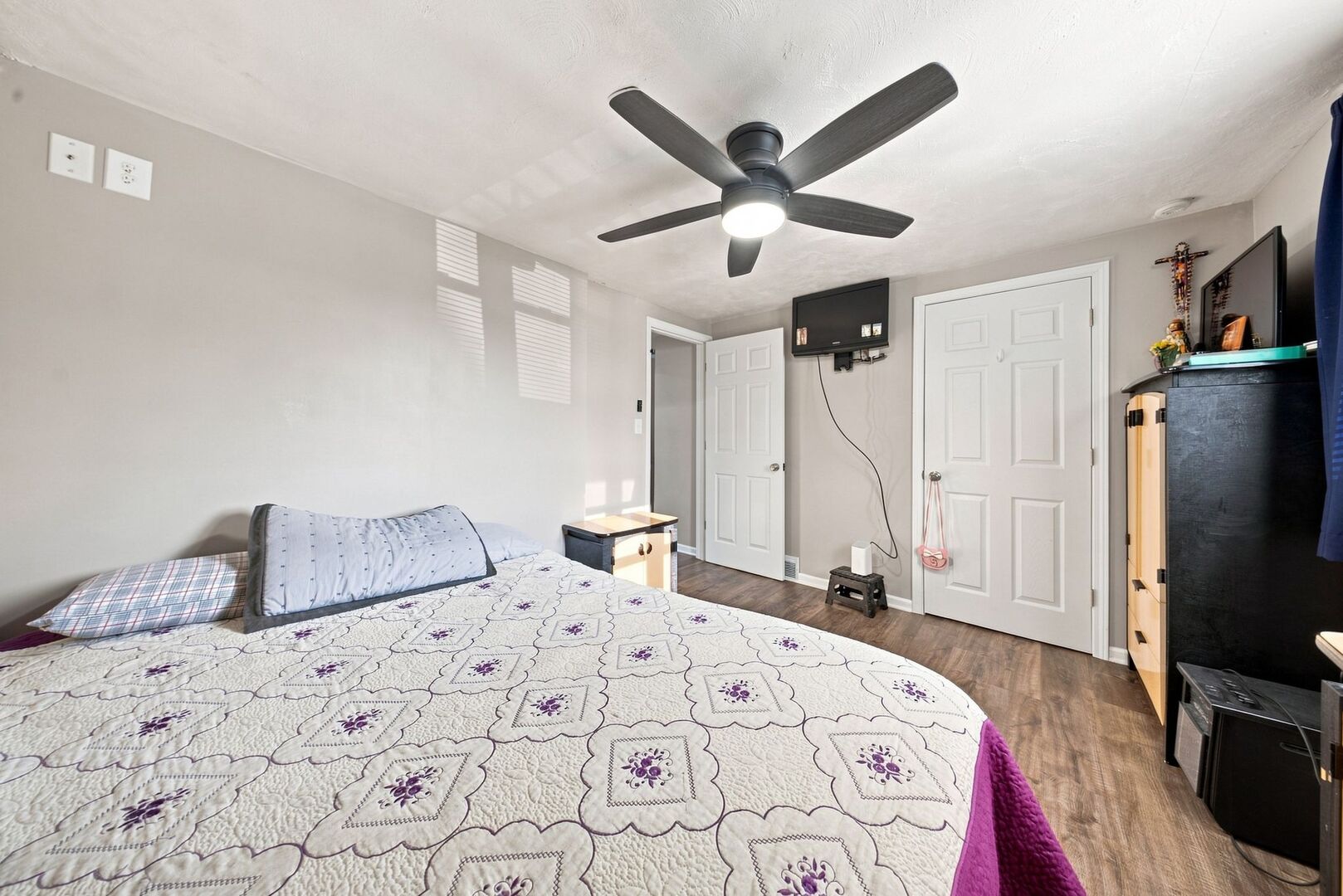 913 Church Road Aurora, IL 60505 - Photo 13 of 31 a bedroom with a large bed and a flat screen tv