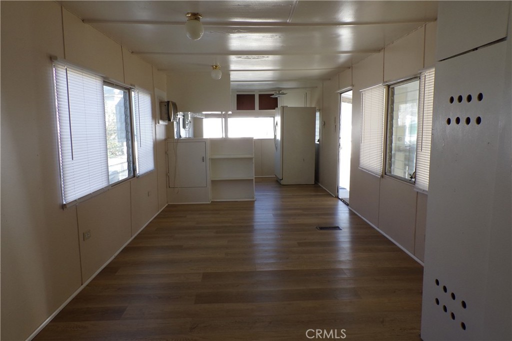12710 3rd Street, Unit 36 Yucaipa, CA 92399 - Photo 7 of 10 a view of hallway with stairs and wooden floor
