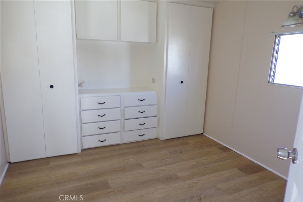 12710 3rd Street, Unit 36 Yucaipa, CA 92399 - Photo 9 of 10 a view of a closet in white cabinet