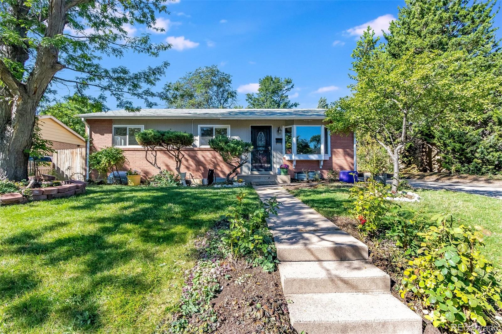 a front view of a house with garden