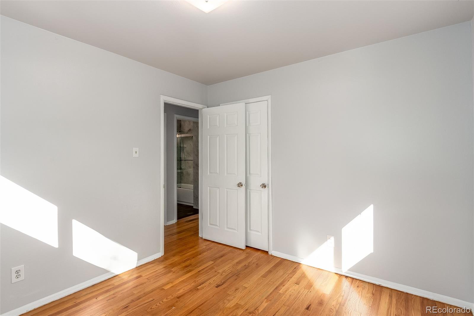 3217 South Stuart Street Denver, CO 80236 - Photo 16 of 30 a view of an empty room and window