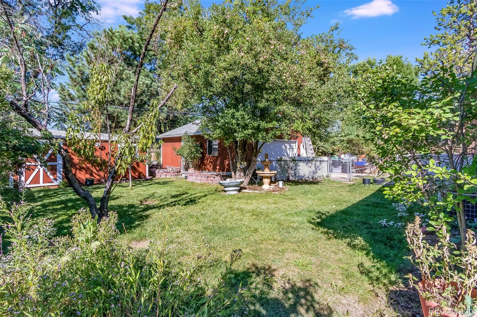 3217 South Stuart Street Denver, CO 80236 - Photo 29 of 30 a view of yard with swimming pool and green space