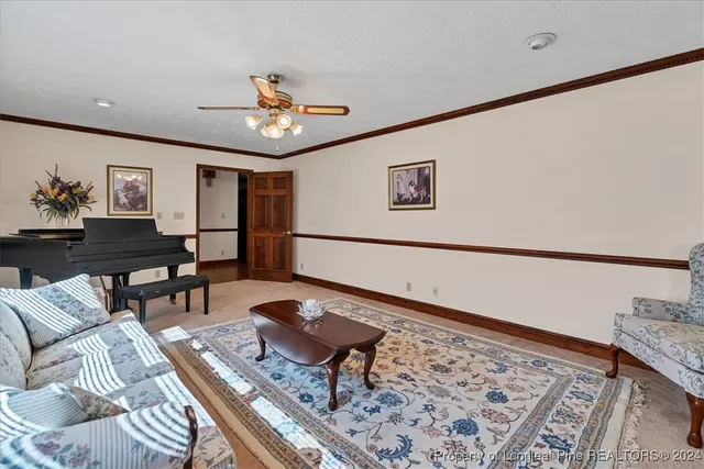 a view of a livingroom with furniture and a window