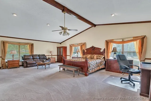 a bedroom with furniture and window