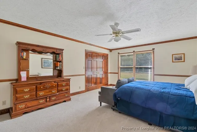 a view of a hallway with wooden floor and dining room