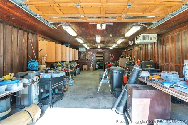 a front view of house with yard and trees in the background