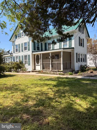 a front view of a house with swimming pool