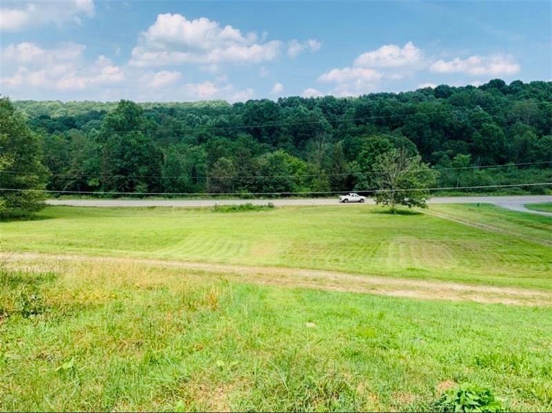 8126 Sharon-Mercer Road Mercer, PA 16137 - Photo 3 of 8 a view of a big yard with a large trees