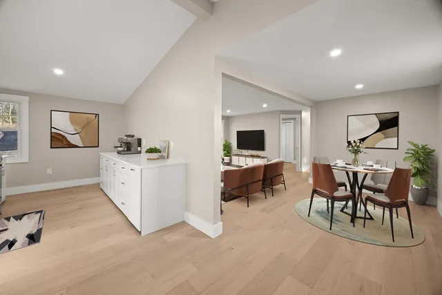 a view of a livingroom with furniture and a flat screen tv