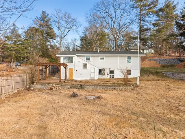 a view of a backyard with large trees