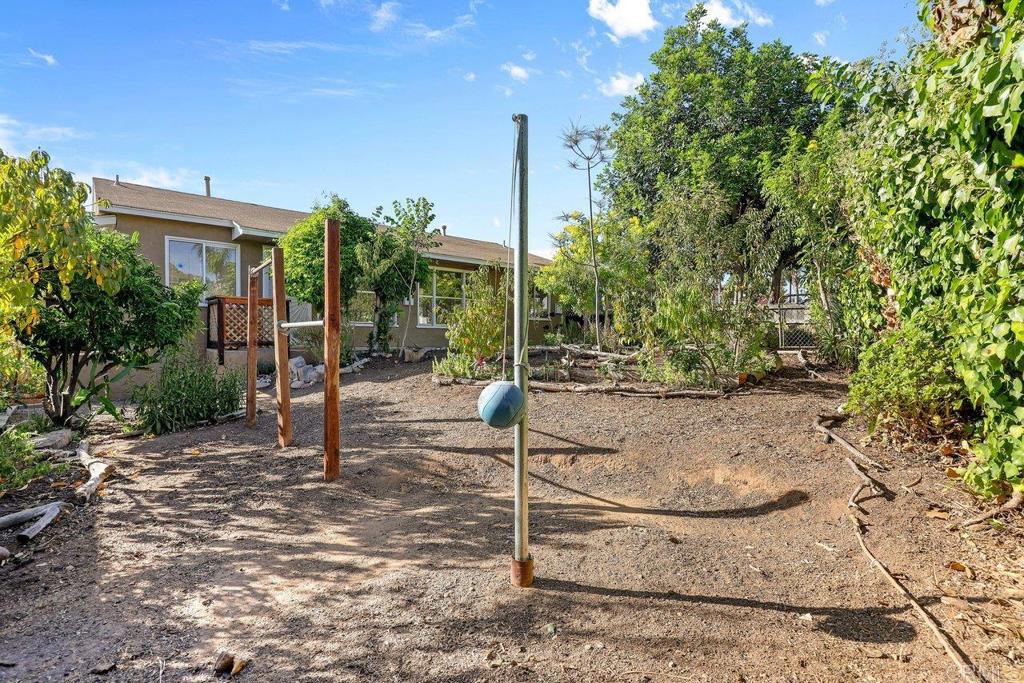 4530-32 4th Street La Mesa, CA 91941 - Photo 30 of 50 a backyard of a house with plants and outdoor seating