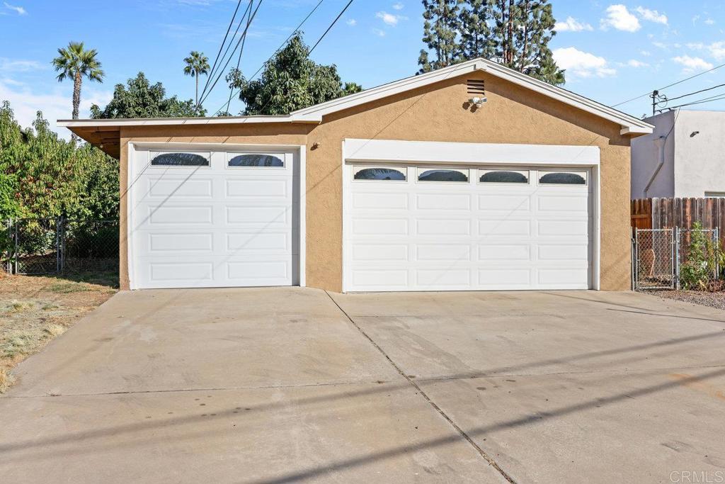 4530-32 4th Street La Mesa, CA 91941 - Photo 38 of 50 a front view of a house with a yard and garage