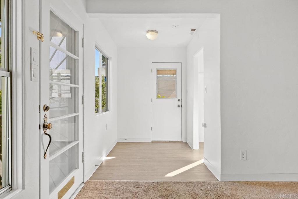 4530-32 4th Street La Mesa, CA 91941 - Photo 6 of 50 a view of a hallway with wooden floor and entryway