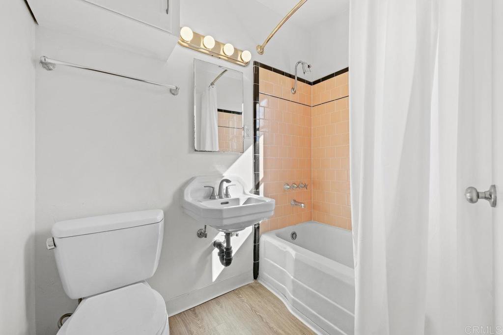 4530-32 4th Street La Mesa, CA 91941 - Photo 10 of 50 a bathroom with a sink a toilet and bathtub