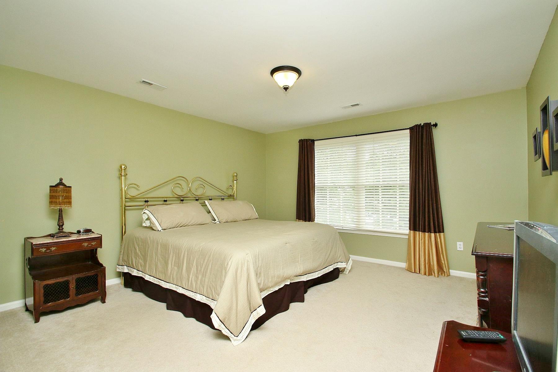425 Stonehaven Lane Blue Ridge, VA 24064 - Photo 22 of 50 a bedroom with a bed and a window