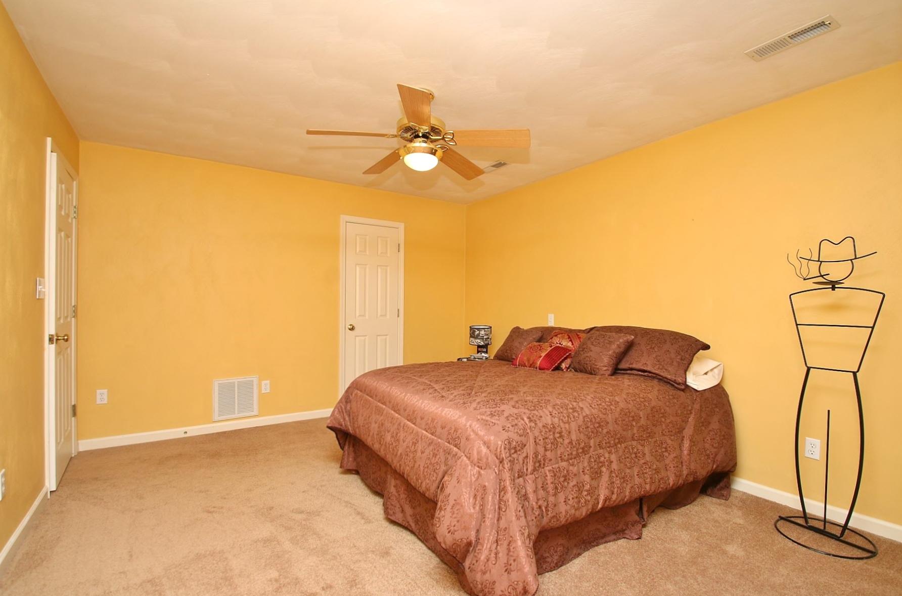 425 Stonehaven Lane Blue Ridge, VA 24064 - Photo 40 of 50 a bedroom with a bed and a chandelier