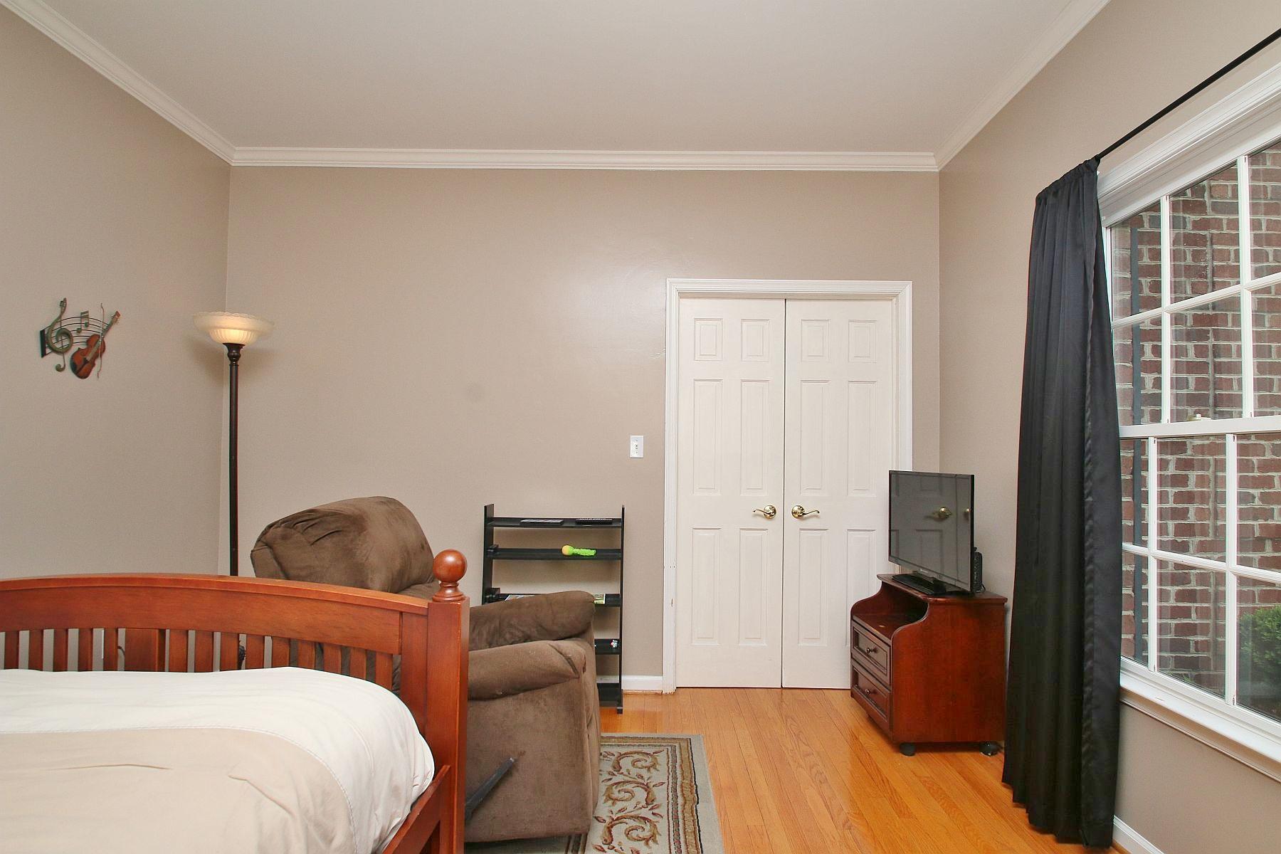 425 Stonehaven Lane Blue Ridge, VA 24064 - Photo 5 of 50 a bedroom with a bed and wooden floor