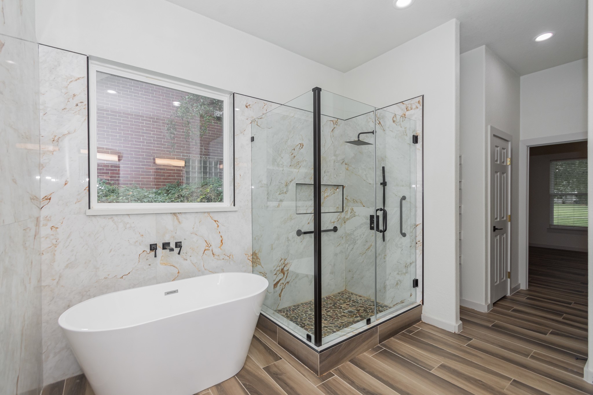 2190 Riverside Drive West Columbia, TX 77486 - Photo 14 of 39 a bathroom with a bathtub and shower