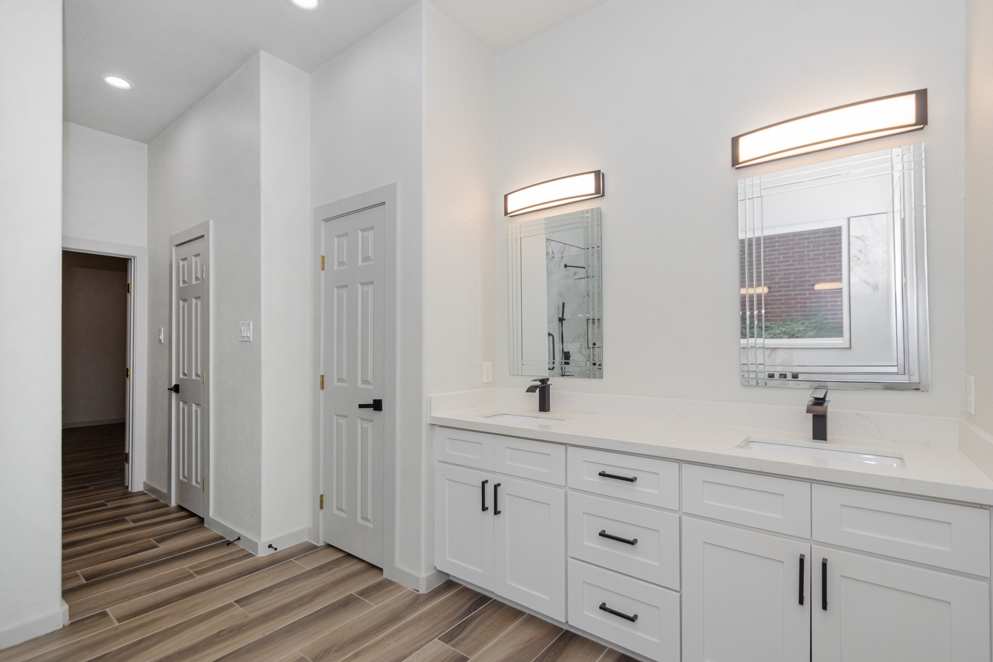 2190 Riverside Drive West Columbia, TX 77486 - Photo 15 of 39 a bathroom with a double vanity sink and mirror