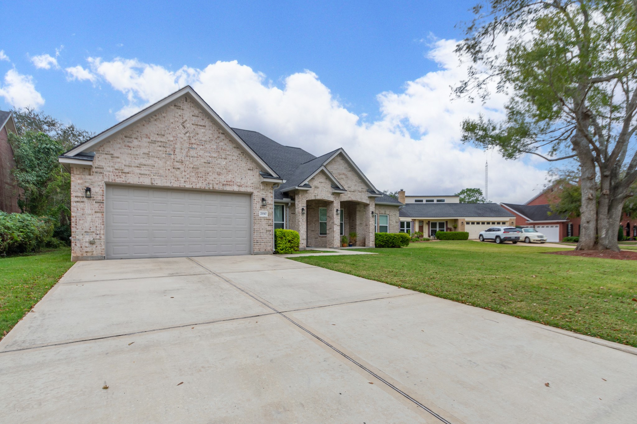2190 Riverside Drive West Columbia, TX 77486 - Photo 2 of 39 a front view of a house with a yard and garage