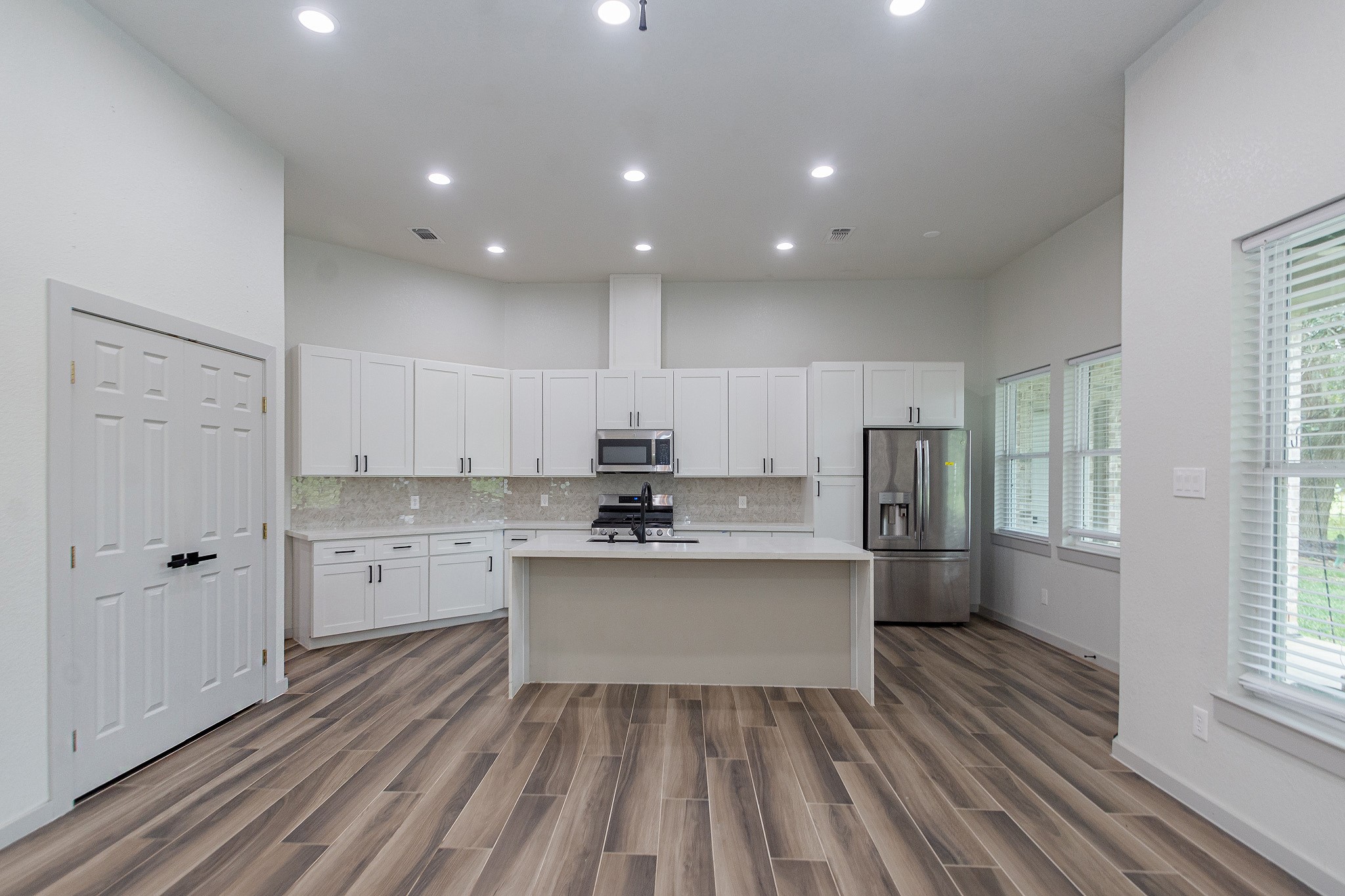 2190 Riverside Drive West Columbia, TX 77486 - Photo 23 of 39 a view of kitchen with sink microwave refrigerator and cabinets