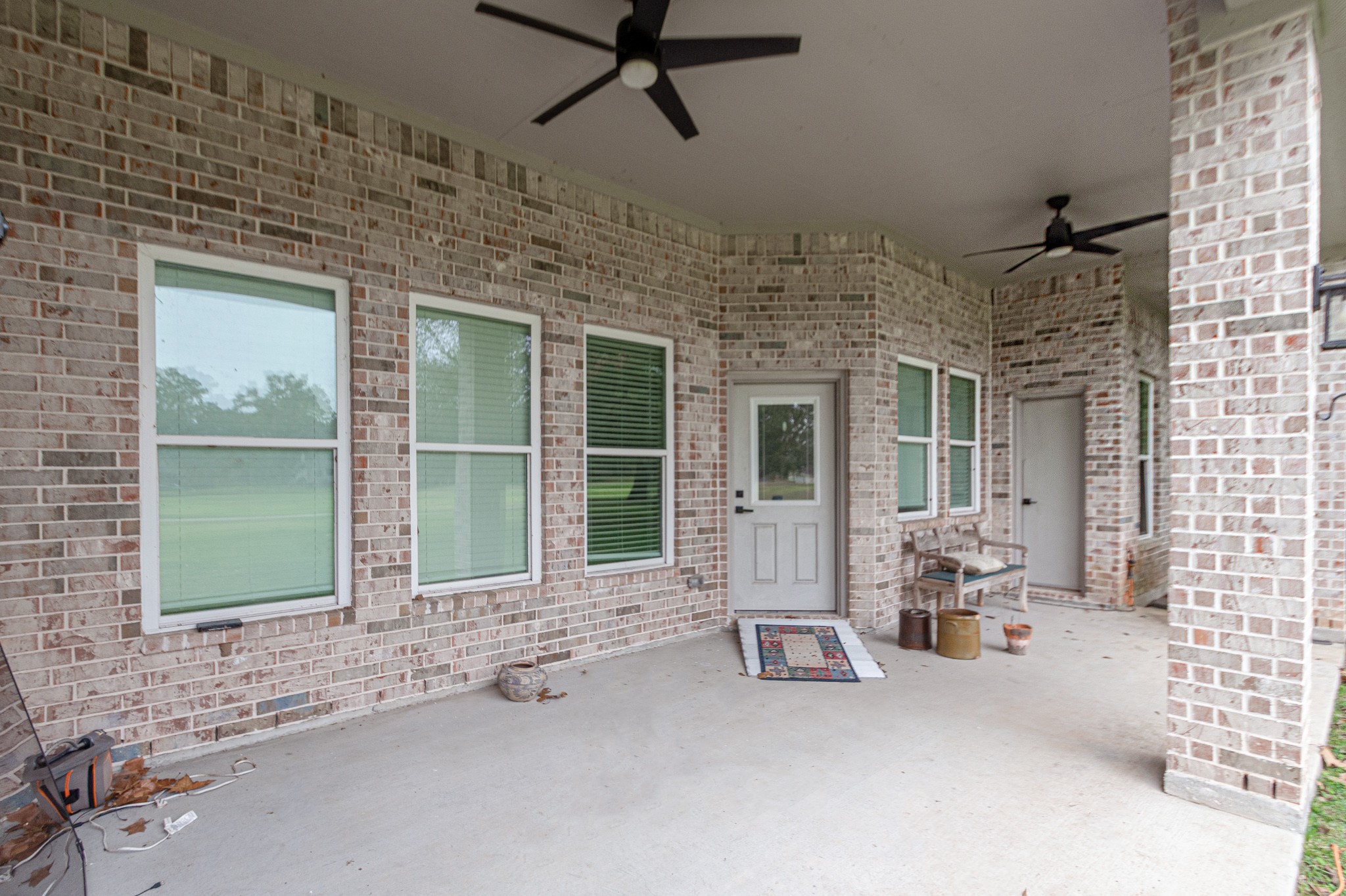 2190 Riverside Drive West Columbia, TX 77486 - Photo 34 of 39 a view of a patio with a table and chairs and potted plants