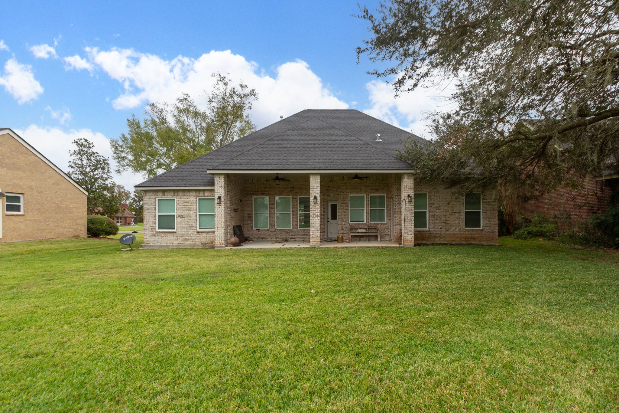 2190 Riverside Drive West Columbia, TX 77486 - Photo 36 of 39 a front view of a house with a garden