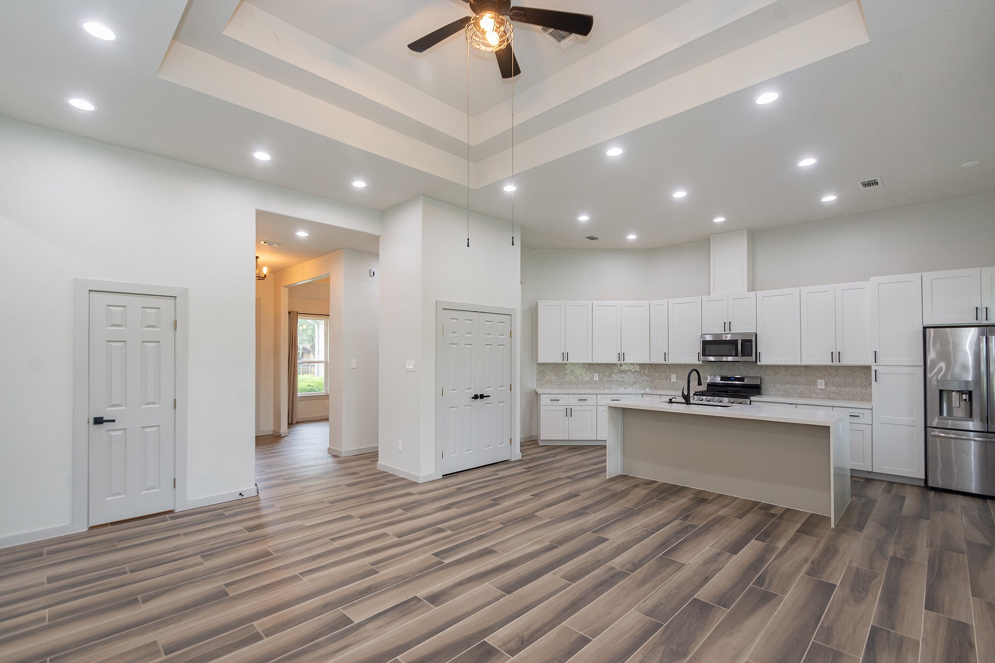 2190 Riverside Drive West Columbia, TX 77486 - Photo 6 of 39 a view of kitchen with stainless steel appliances refrigerator stove microwave and cabinets