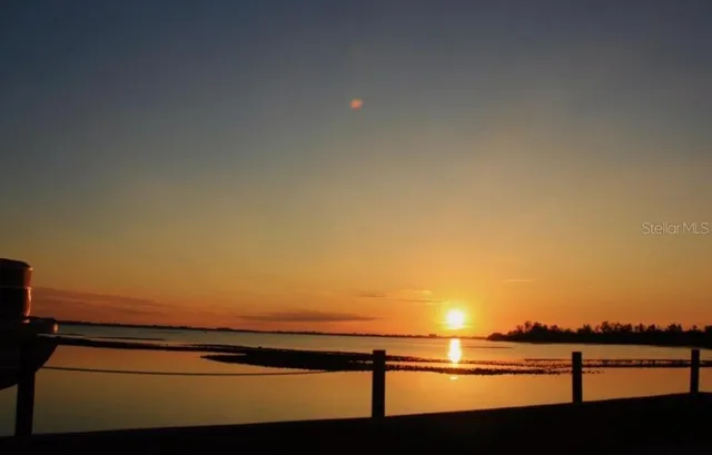 a view of empty room with lake view