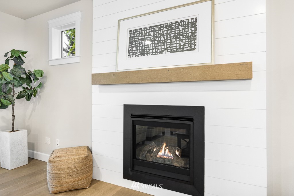 22915 31st Avenue Southeast Bothell, WA 98021 - Photo 13 of 40 a living room with a fireplace and a potted plant