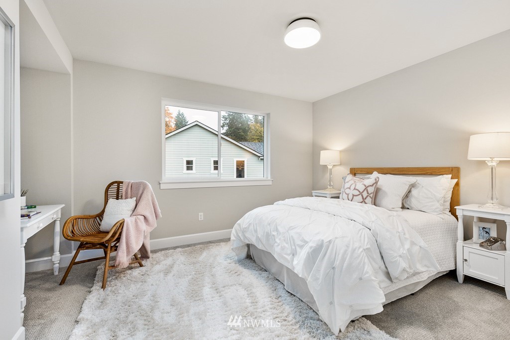 22915 31st Avenue Southeast Bothell, WA 98021 - Photo 34 of 40 a bedroom with a bed a chair and next to a window