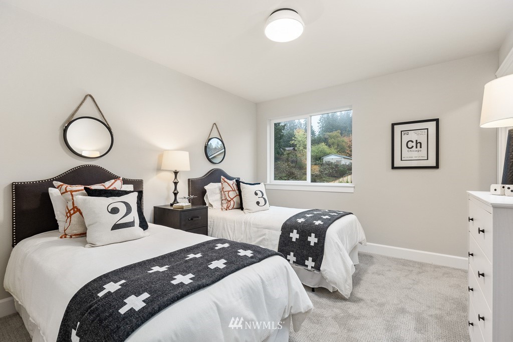 22915 31st Avenue Southeast Bothell, WA 98021 - Photo 35 of 40 a bedroom with two beds and a window
