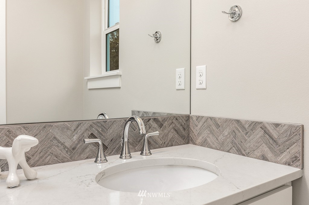22915 31st Avenue Southeast Bothell, WA 98021 - Photo 36 of 40 a bathroom with a sink and a mirror
