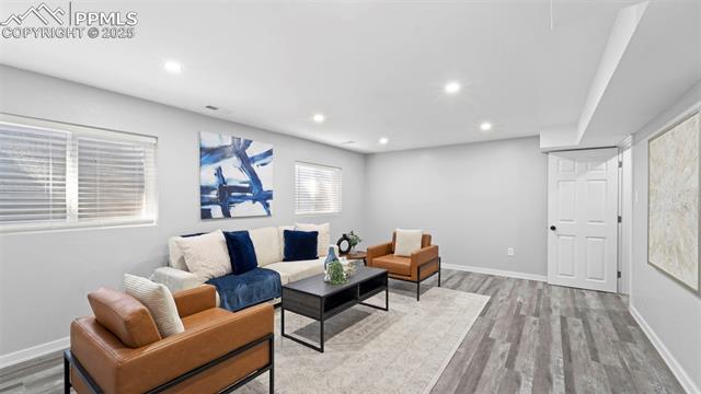 562 Blossom Field Road Fountain, CO 80817 - Photo 20 of 41 Living area with recessed lighting and light wood-style flooring