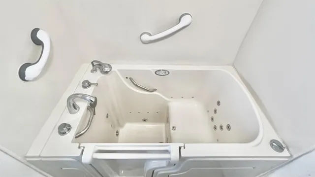 a bathroom with a bathtub and shower