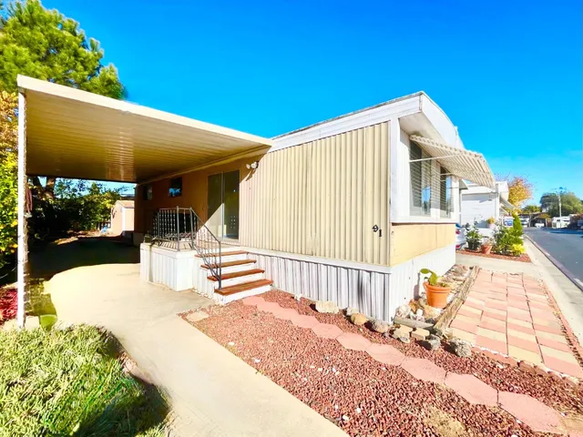 a front view of a house with a outdoor space