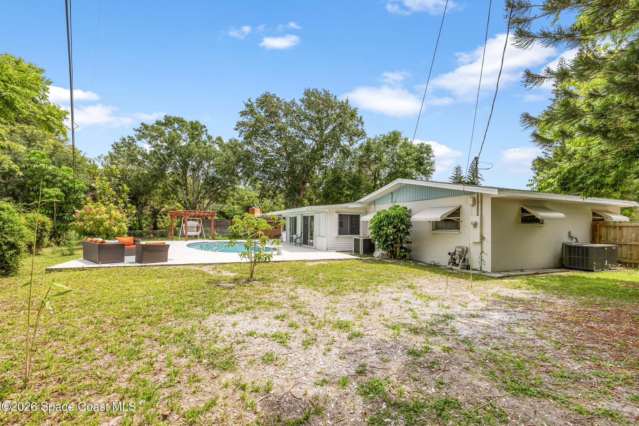 24 Hardee Circle South Rockledge, FL 32955 - Photo 3 of 6 a view of a house with pool and a yard