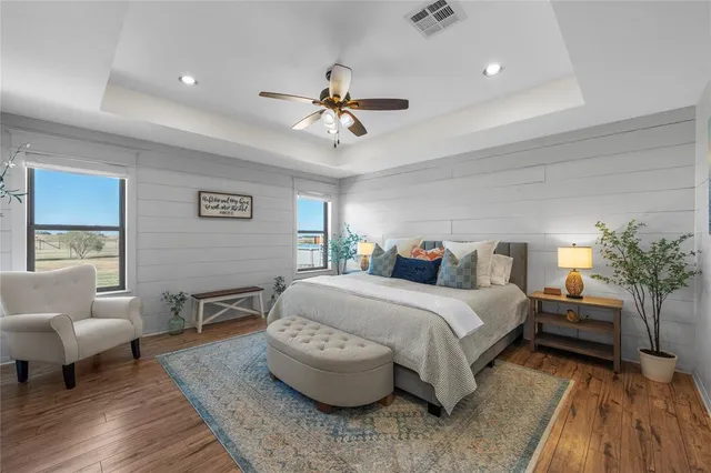 a bedroom with a bed and a couch