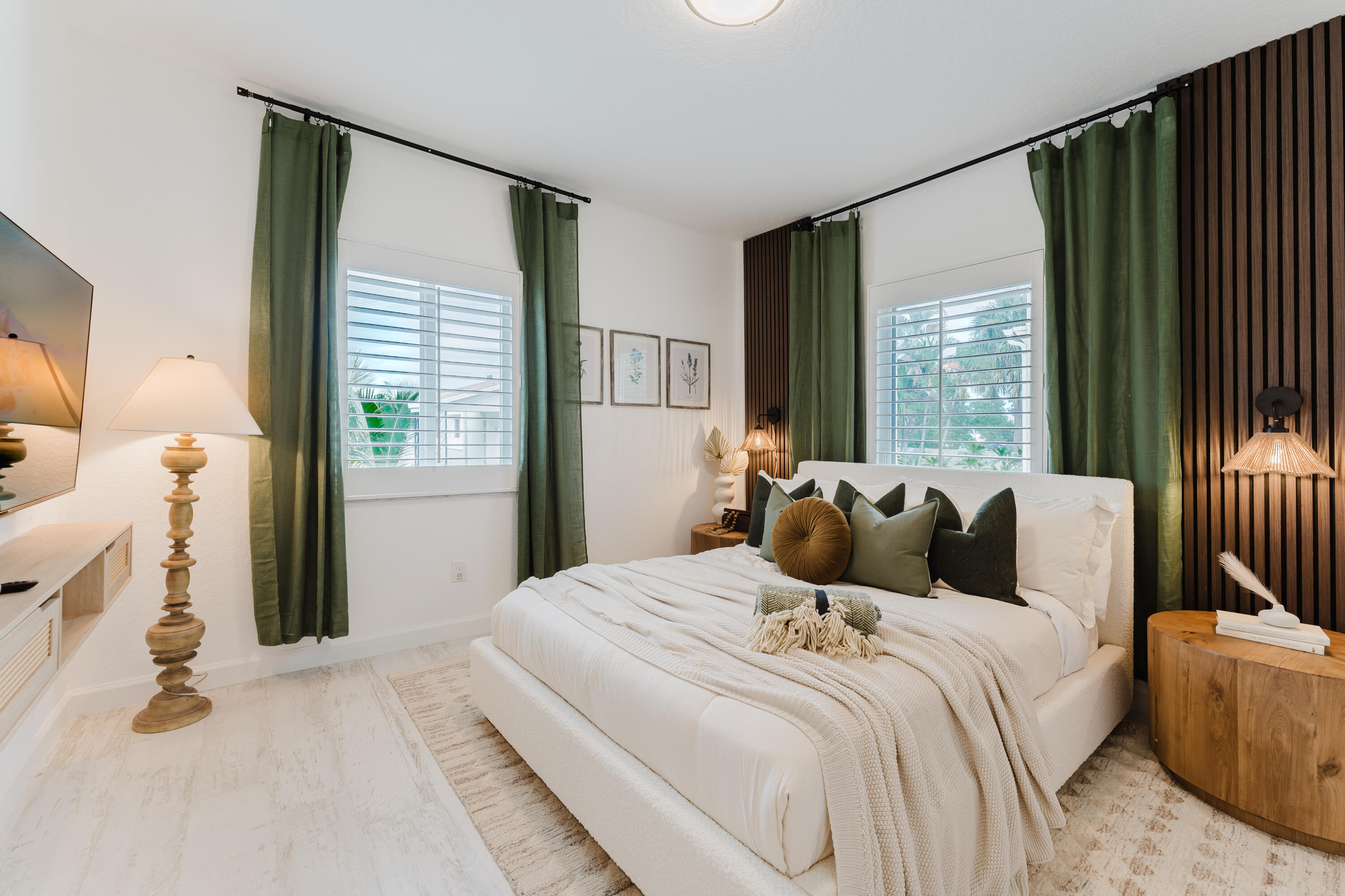 921 Ortega Road West Palm Beach, FL 33405 - Photo 21 of 60 a bedroom with a bed and large windows