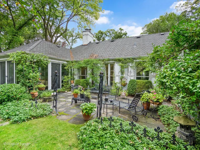 a front view of a house with a yard and a garage