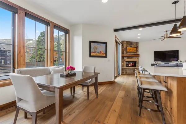 a view of a dining room with furniture and wooden floor