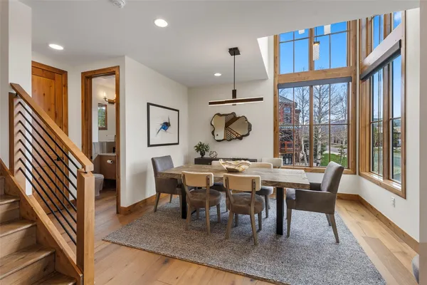 a view of a dining room with furniture window and wooden floor