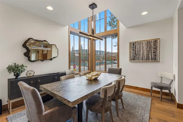 a view of a dining room with furniture window and wooden floor