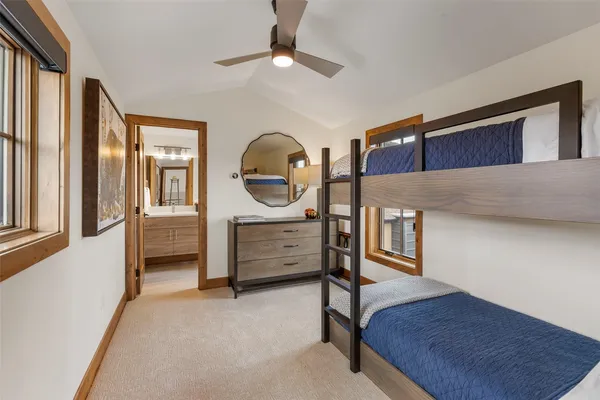 a bathroom with a sink a toilet a shower and a mirror