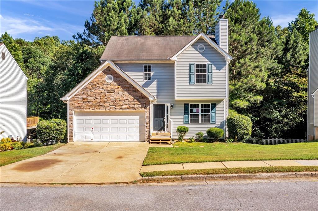 271 Bainbridge Circle Dallas, GA 30132 - Photo 1 of 1 a front view of a house with a yard
