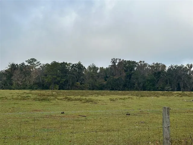 a view of a lake with houses in the back