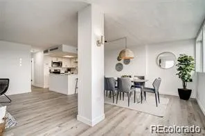 a view interior of kitchen and dining room with wooden floor