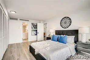 a bedroom with a bed and a table